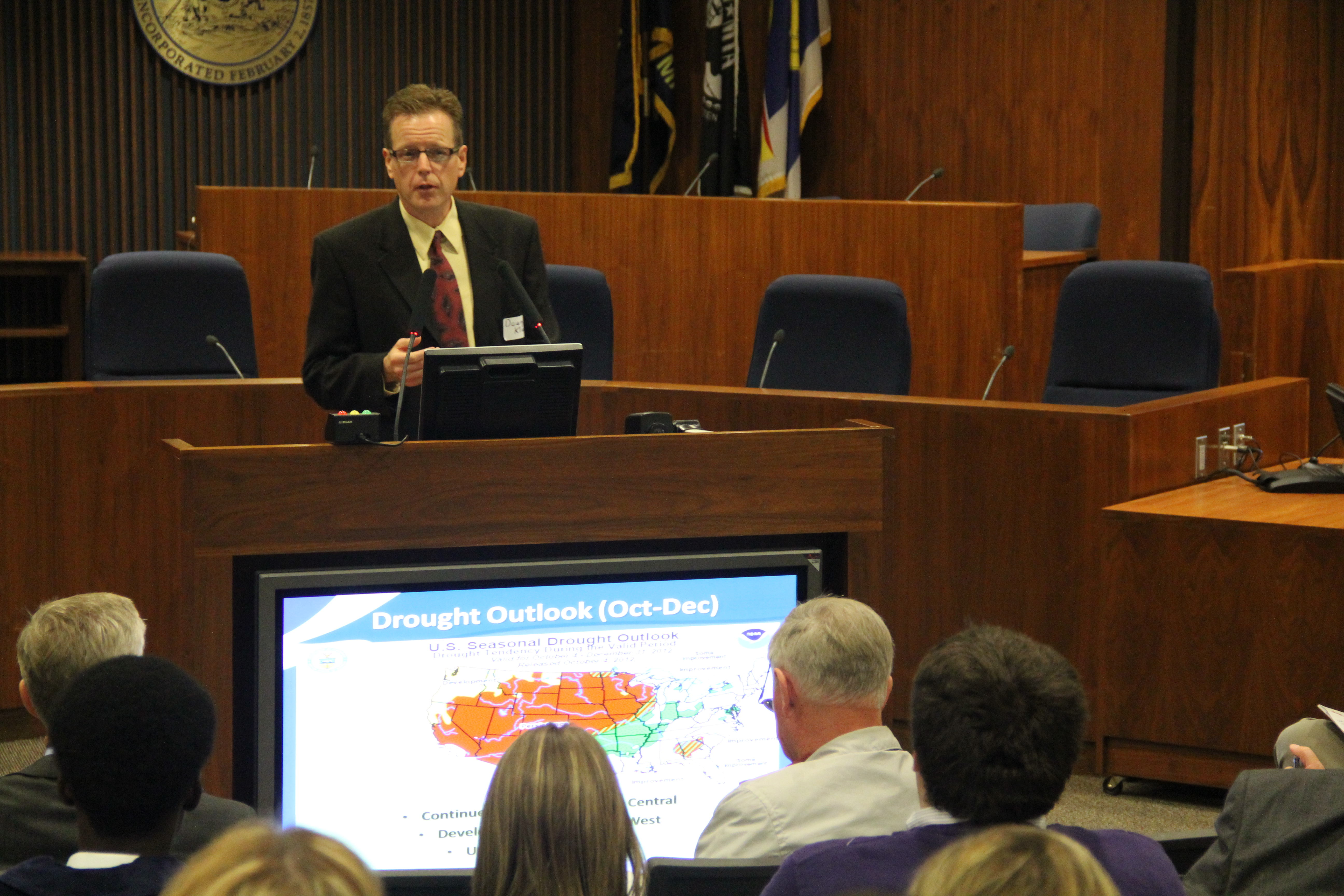 Doug Kluck speaking at a meeting