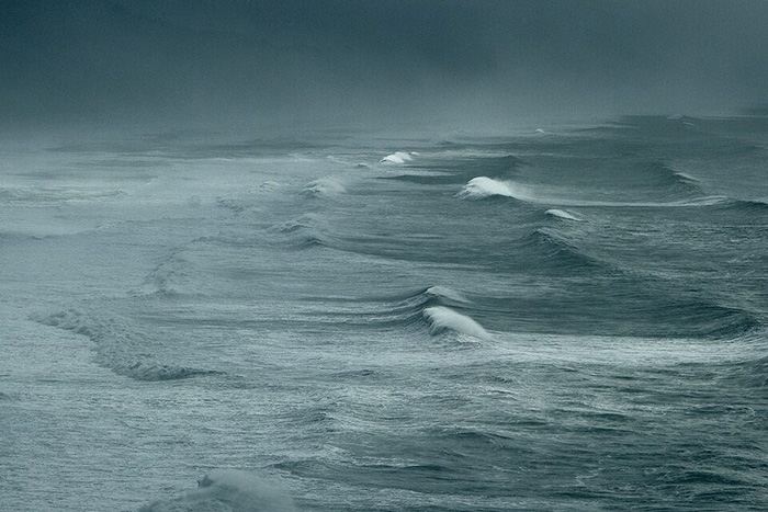 Ocean waves and cloudy sky