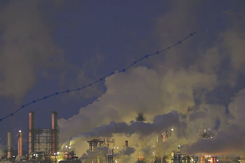 Smoke stacks and clouds of steam and smoke from coal-burning power plant