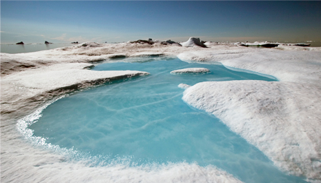 Photo of a meltwater pond on an iceberg in Northwest Greenland in 2011.
