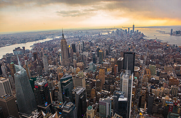 Aerial photo of skyscrapers and other desnley packed buildings on Manhattan Island, New York.