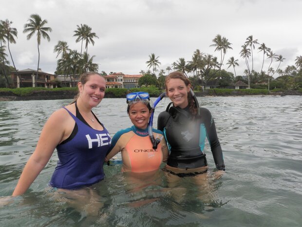 Photo of La Valle and two female undergraduate students standing in water near shore