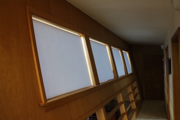 Photo of a hallway showing windows blocked with foam-core board