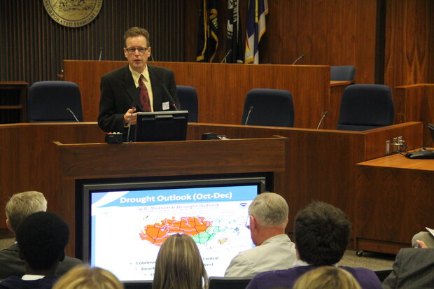 Doug Kluck speaking at a meeting