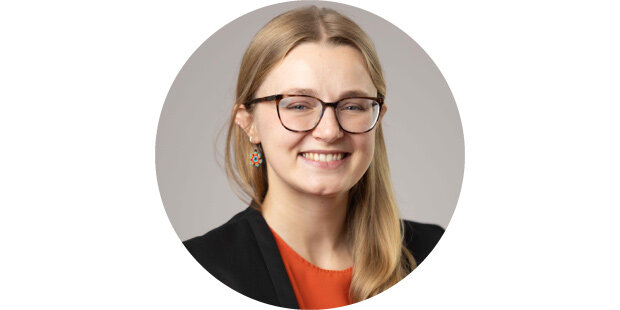 photo of a smiling woman wearing glasses