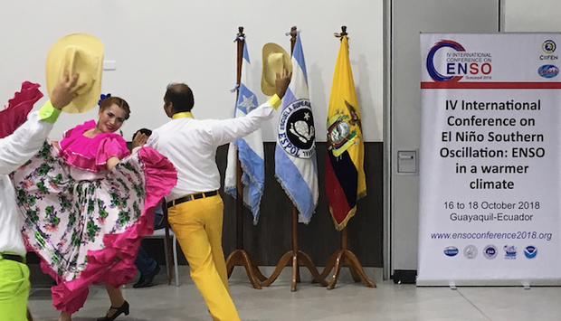 Man and woman dancing in traditional Ecuadorian costumes